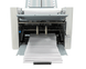 Output conveyor with adjustable stacker wheels for neat, sequential stacking