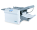 Telescoping outfeed stacker in closed position for small spaces, can be extended to hold up to 500 folded sheets